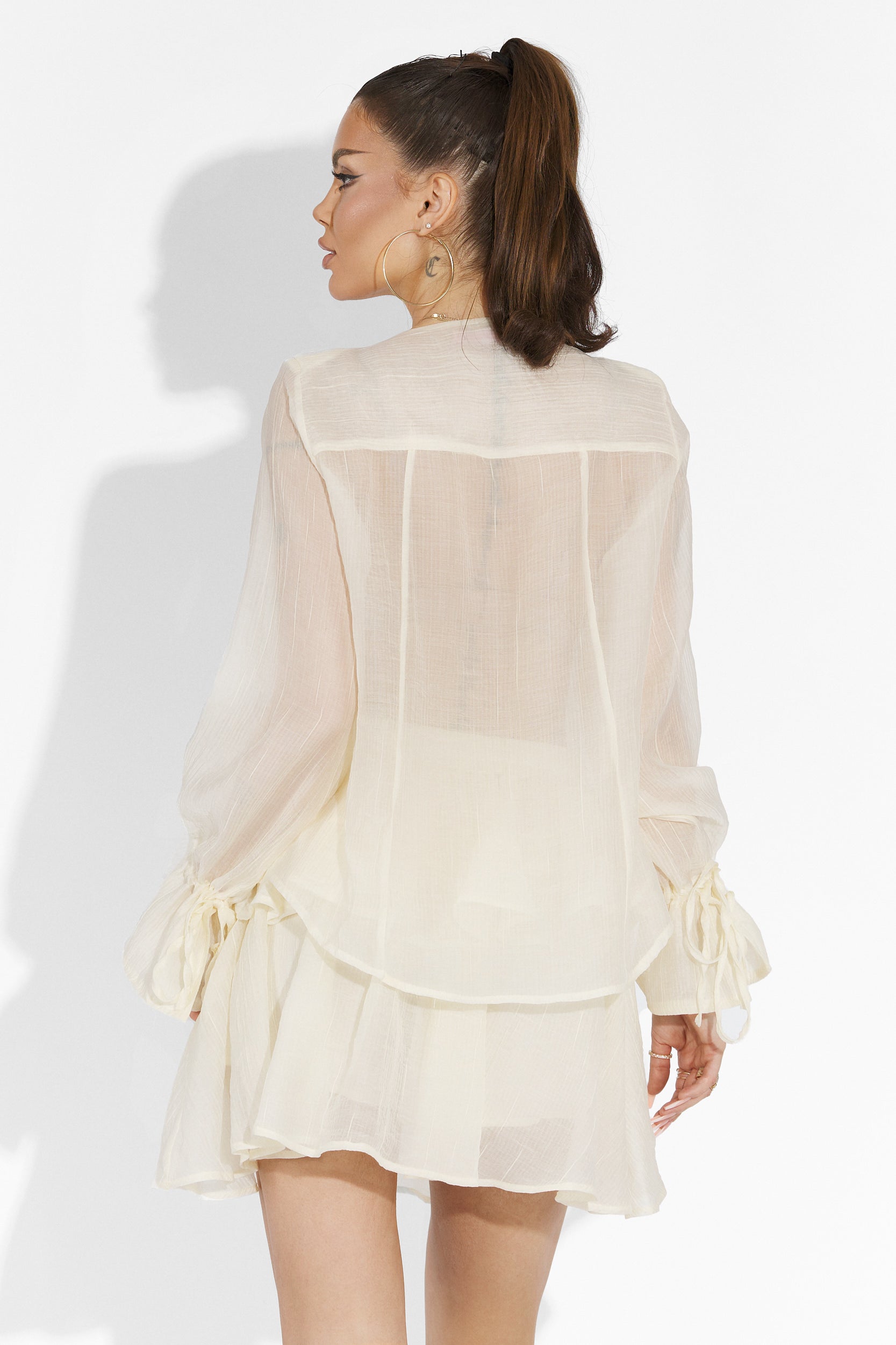 Beige Sabryna Bogas pantsuit with skirt